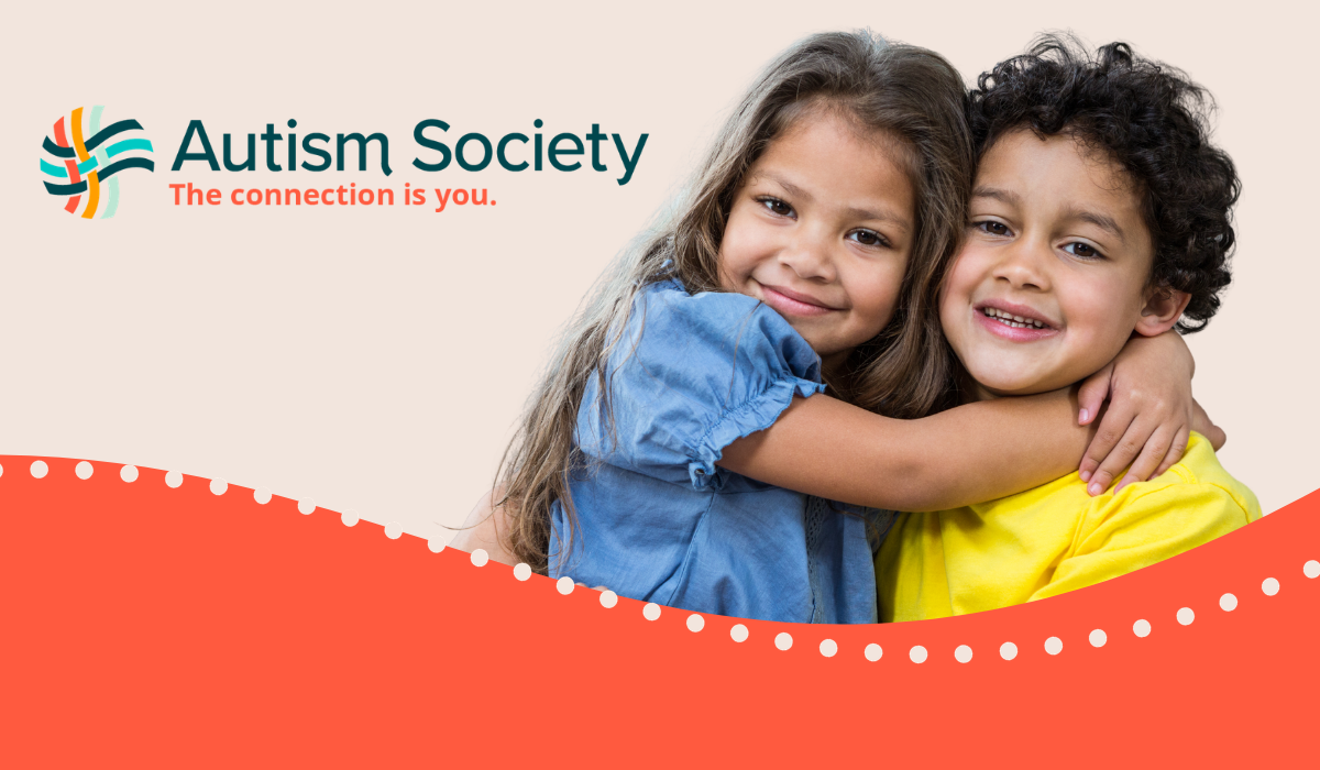 A young boy and girl hugging and the Autism Society Logo
