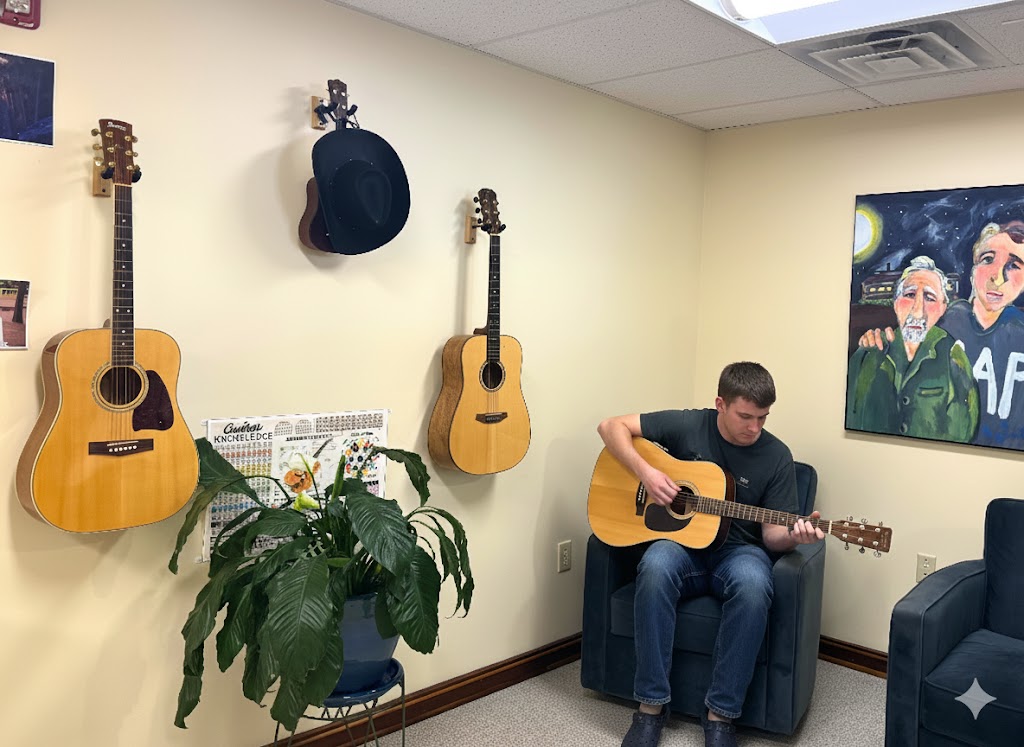 man playing guitar