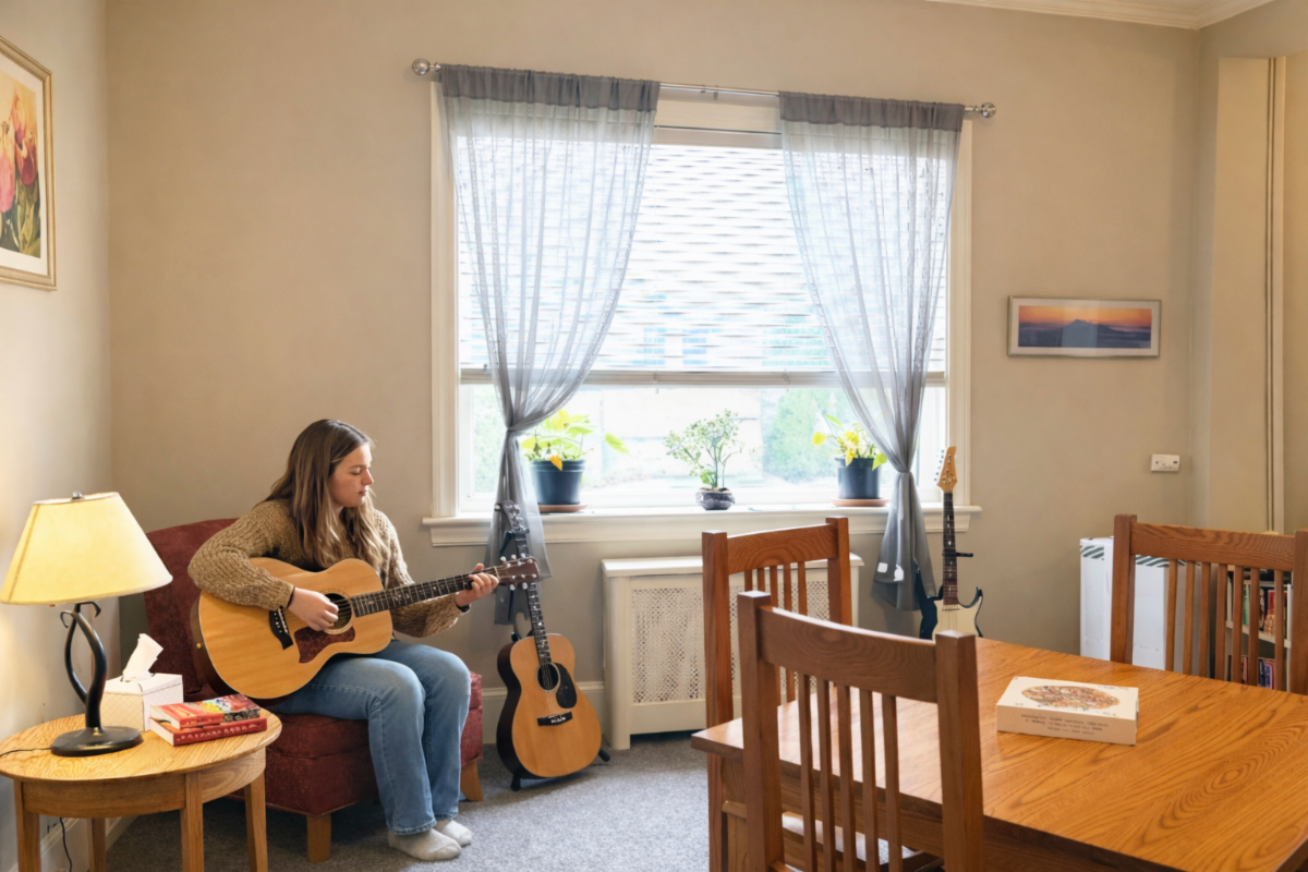 Girl Playing Guitar at the Commons
