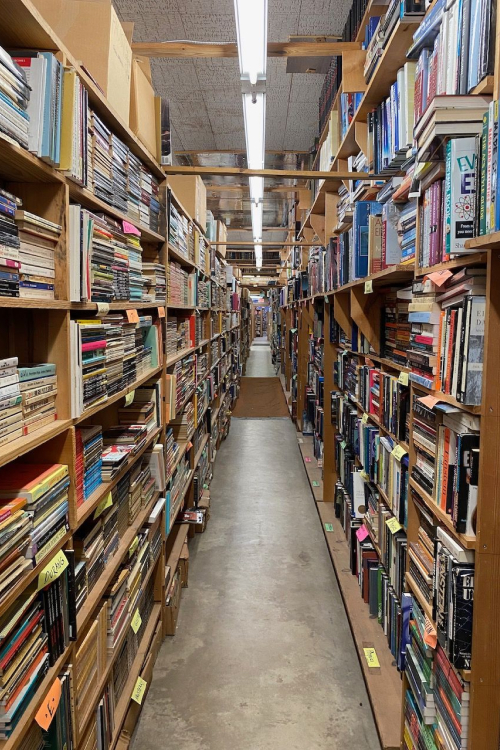 Rows of packed bookshelves inside Chamblin Bookmine