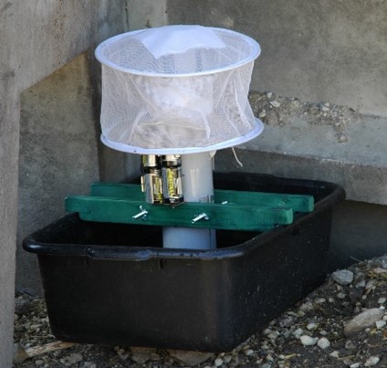Gravid traps target Culex mosquitoes. Who are the main vector of WNV. This trap uses a tray of cow manure water that attracts female mosquitoes looking for a place to lay her eggs.