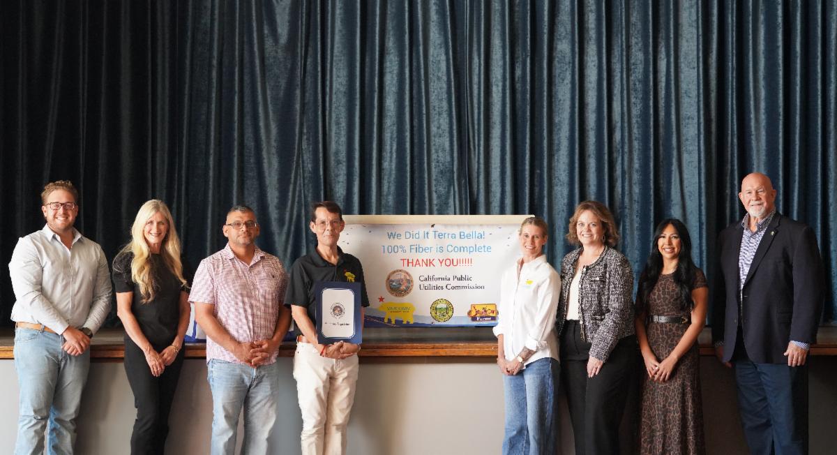 County, VARCOMM and community representatives pose together at a celebration marking completion of Terra Bellaâs fiber broadband project.