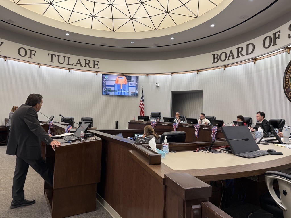 RMA Associate Michael Washam delivers economic development presentation while Tulare County Board of Supervisors listens.