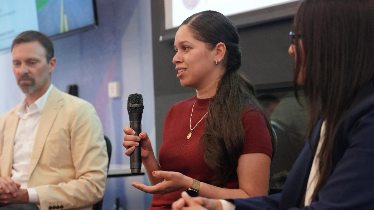 Claudia Sanchez, Engineer IV, speaks during a panel discussion at the WTS South Valley Membership Luncheon while Reed Schenke and Alida Verduzco Silva listen.