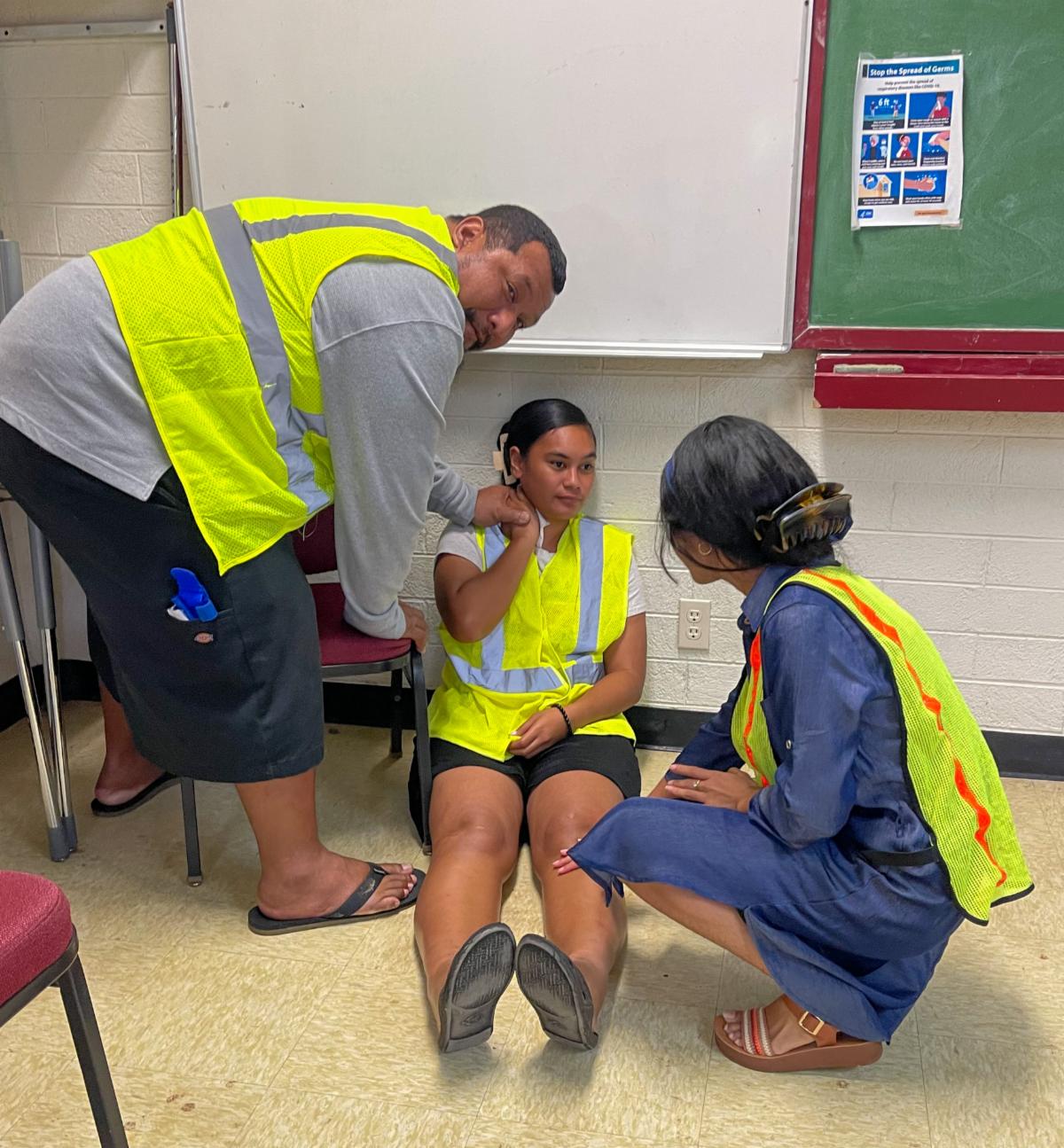 Demonstration with participants working on an acting injured person. 