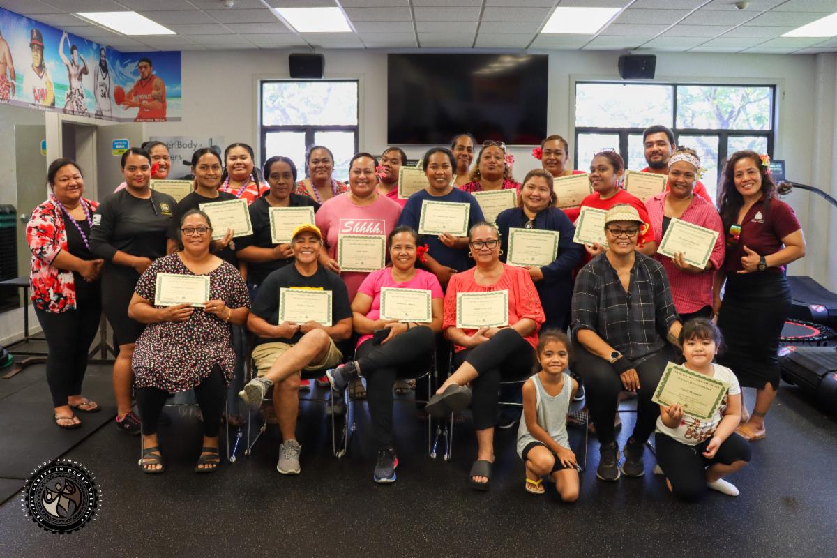 Group photo of Homemaker class with their certificates for completing the program. 