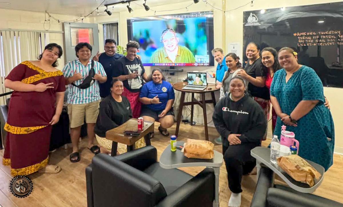 Group photo of students and guest speaker Pierce College student on the TV screen.