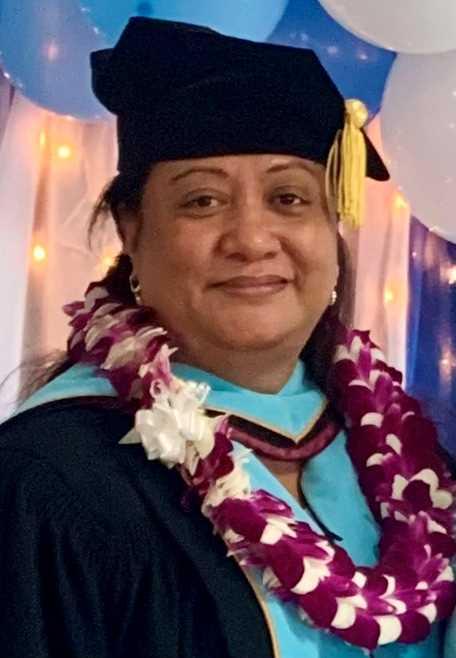 Dr. Letupu Moananu in doctorate regalia.