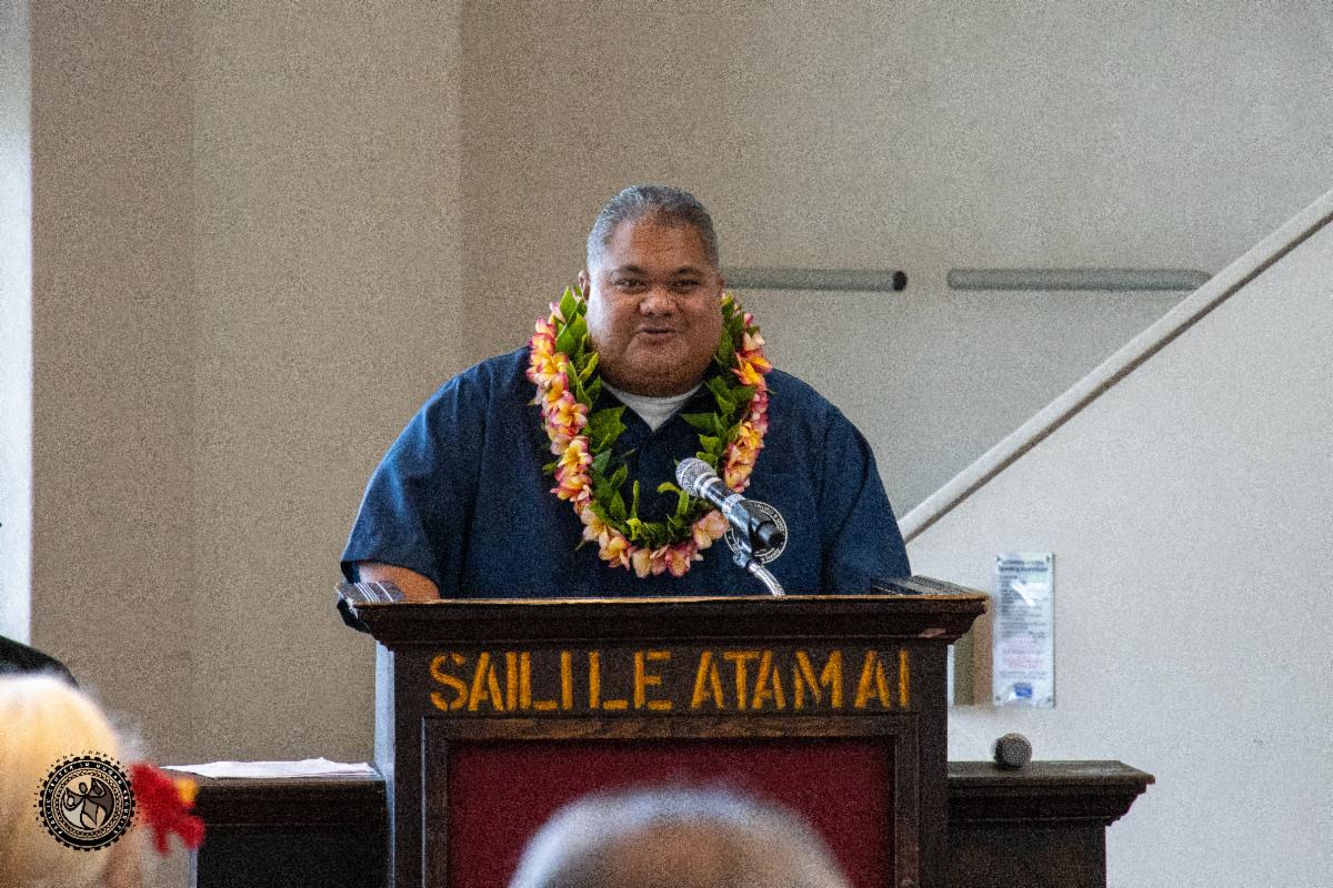 Deputy Director Mathew Tuia making his speech at the podium.