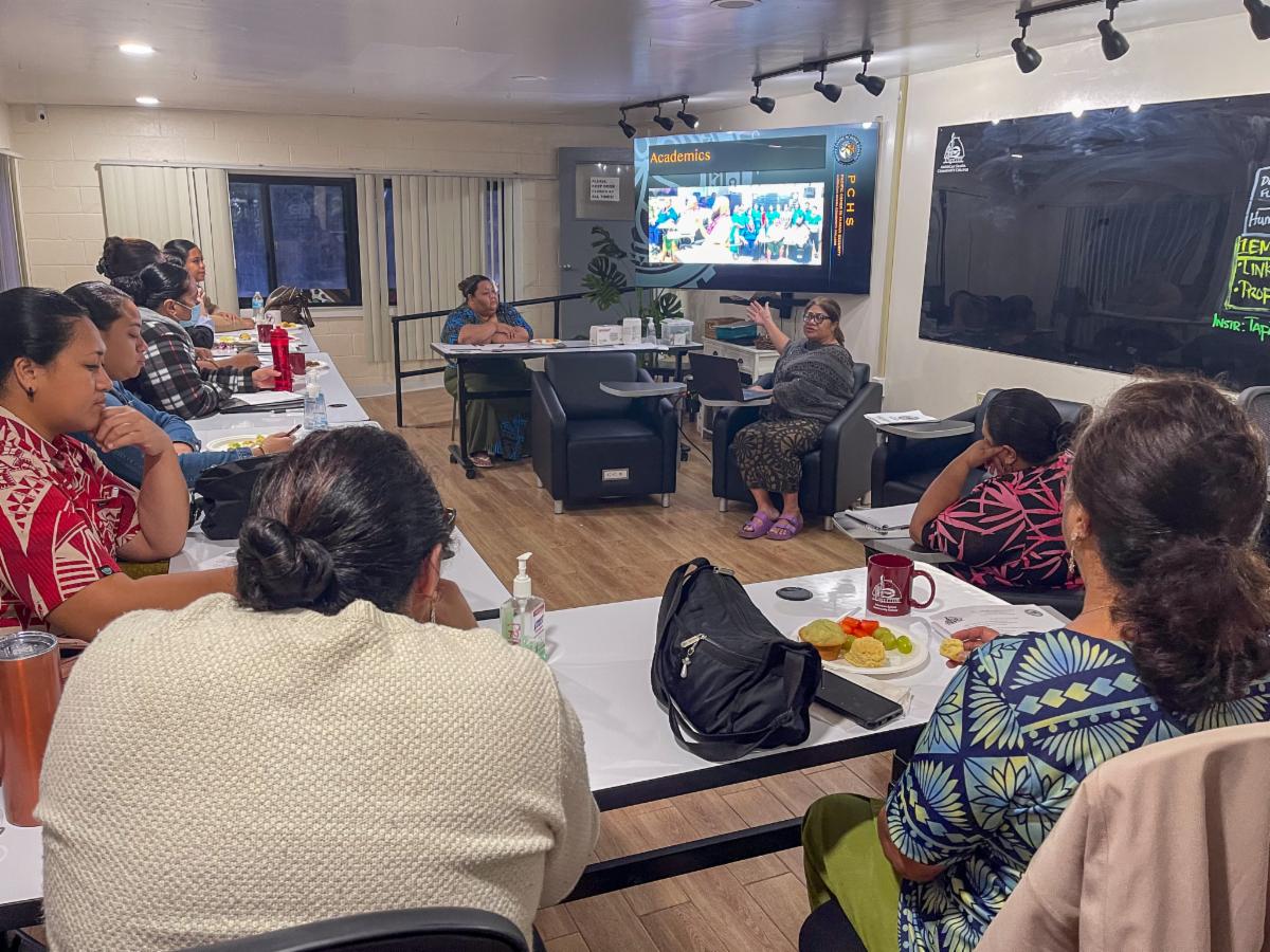 Council members looking at State Director presentation