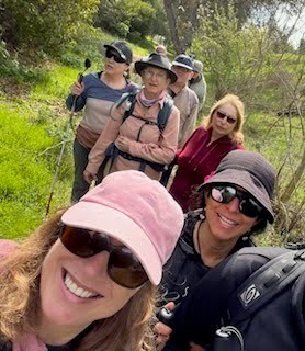 Group taking a selfie in the middle of a hike