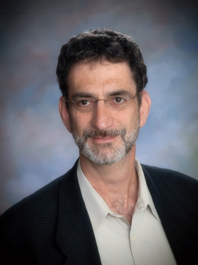man in blazer and shirt smiling