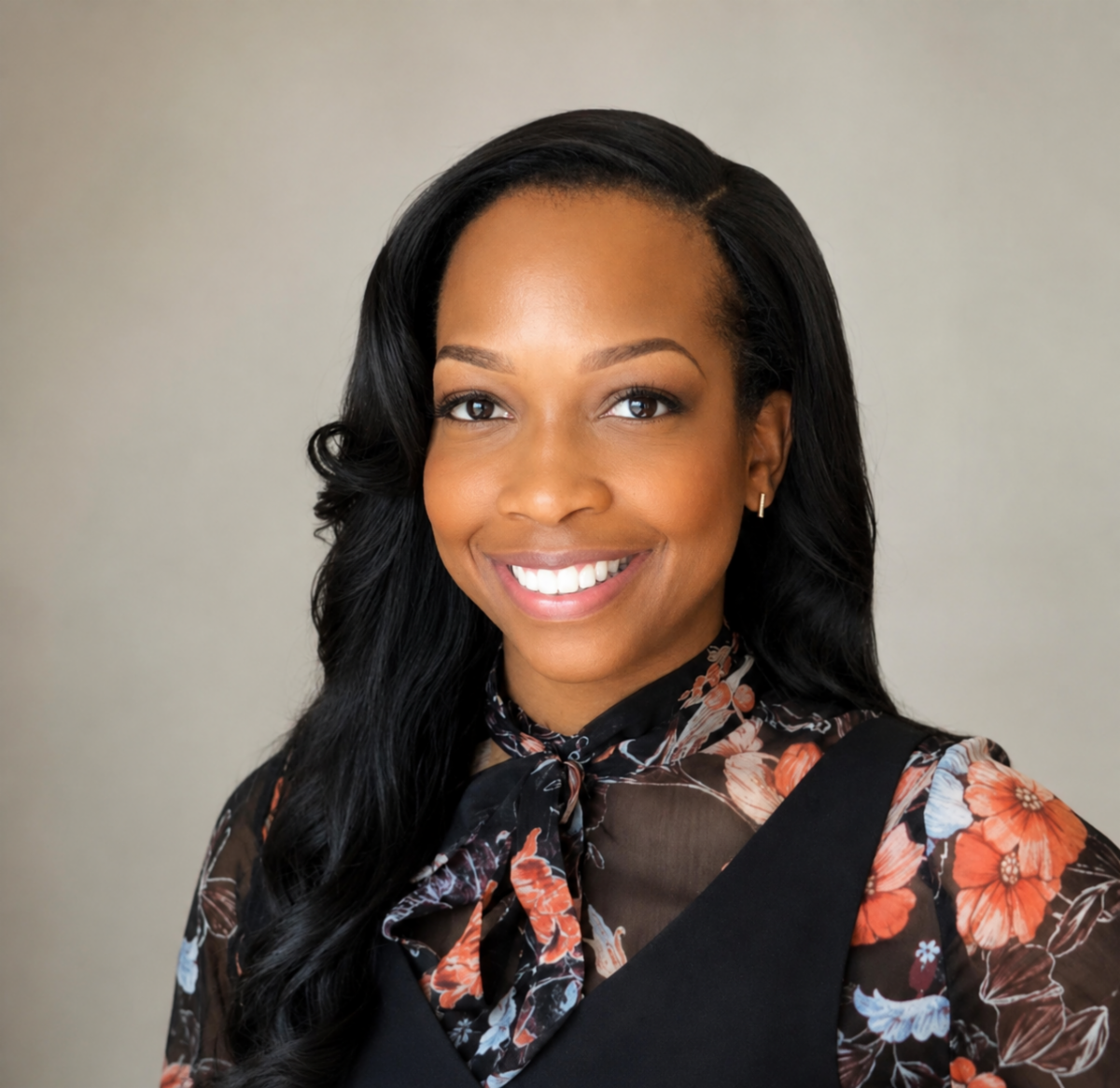 woman smiling wearing floral blouse