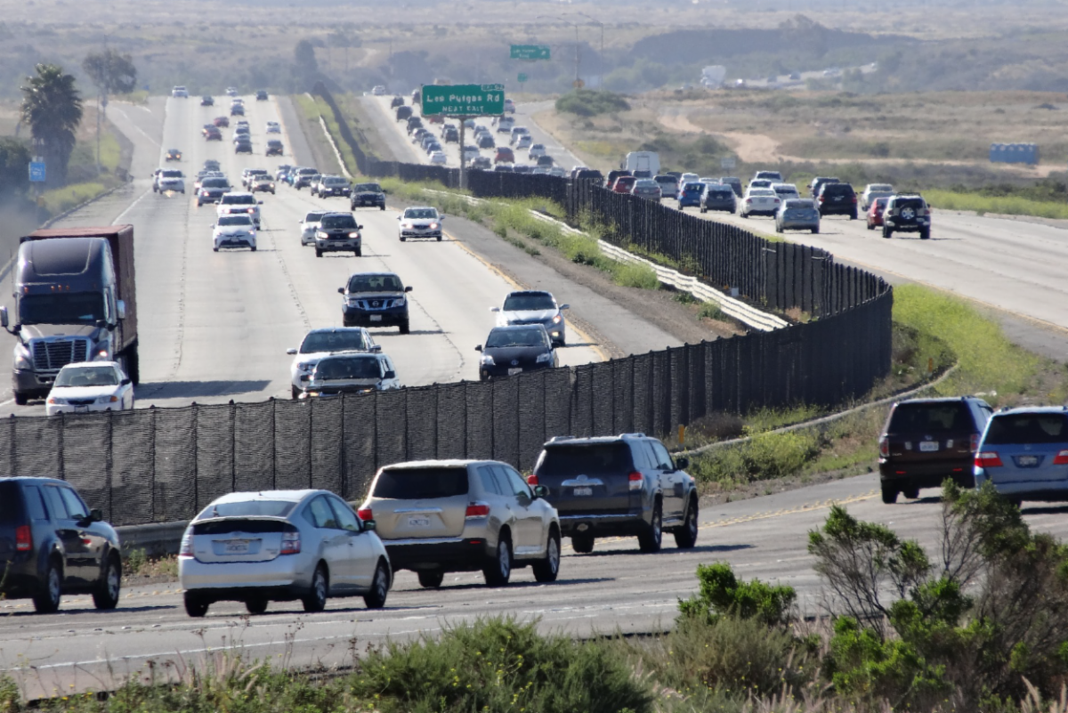 Cars traveling on a highway. Photo by Pixabay