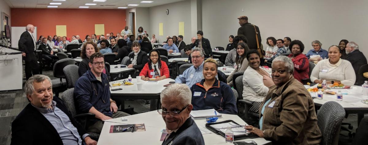 A group of people sitting at tables