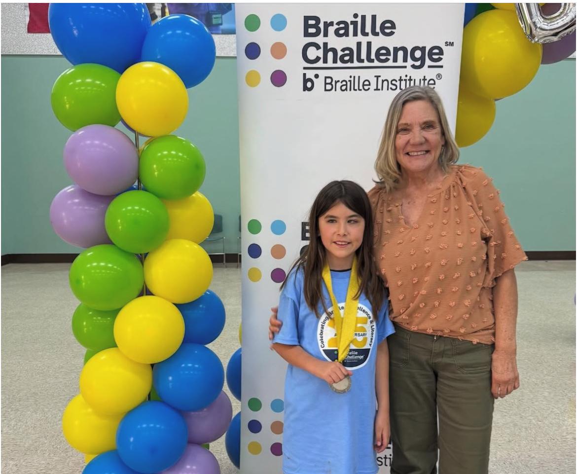 Student and teacher at Braille Challenge