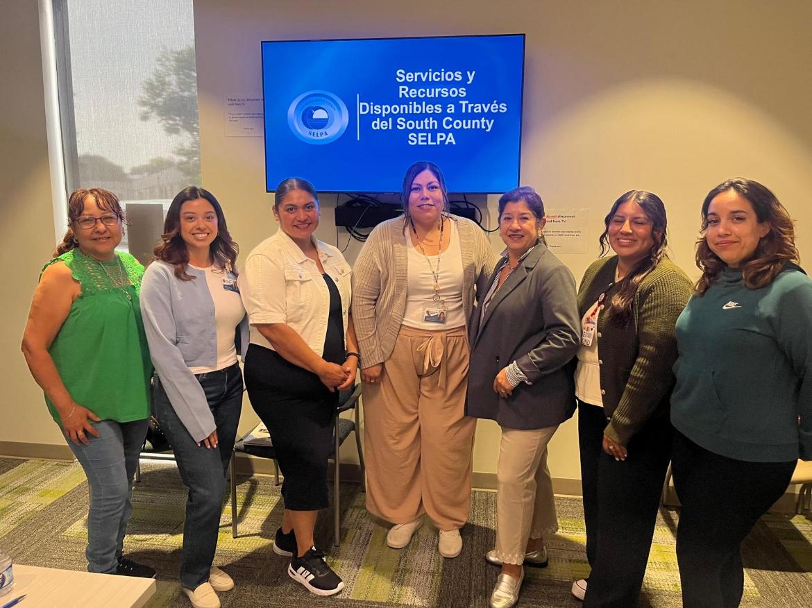 Members of San Ysidro Health Center posing with our staff at a presentation