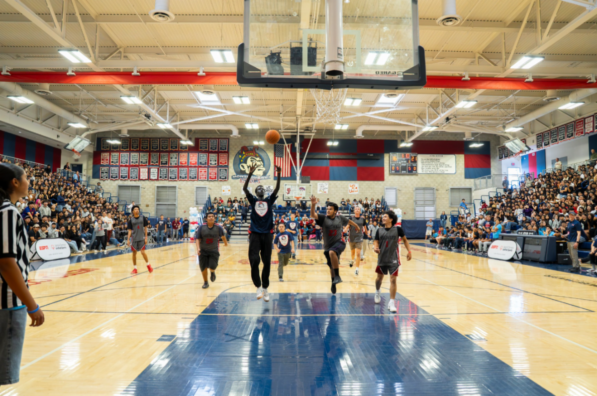 Students in the Montgomery High School gym playing in a unified basketball game