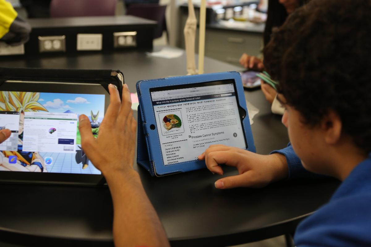 Image of IPads screen and student