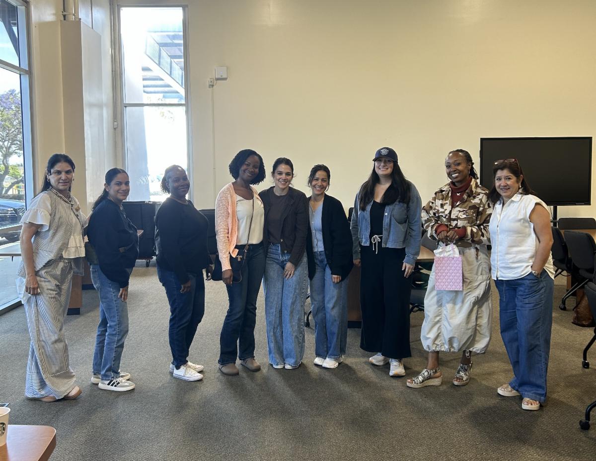 Parents standing together for a group photo at our parent support group meeting