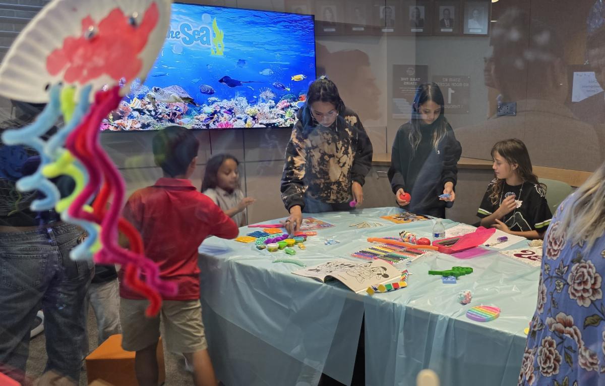 Students working on art projects in the sensory room