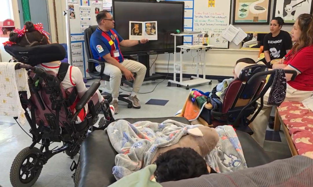 Students at Friendship School listening to a story being told