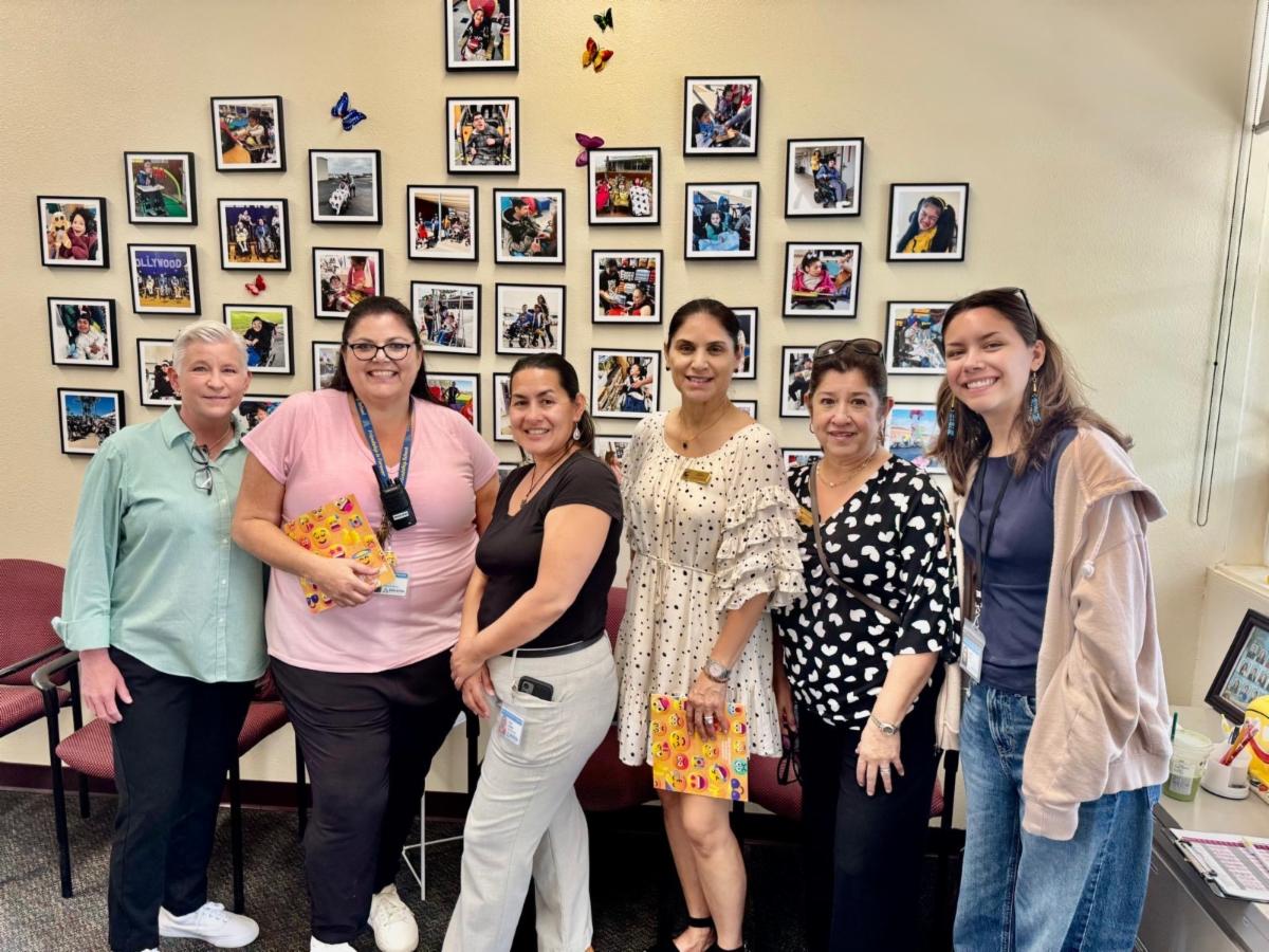 Staff standing together in the Friendship School Principal's Office