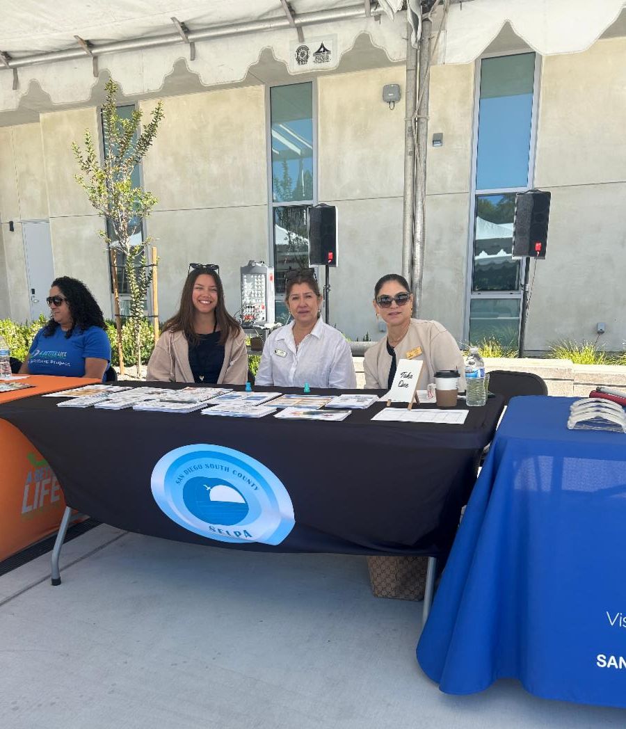 SELPA team members sitting behind our resource table