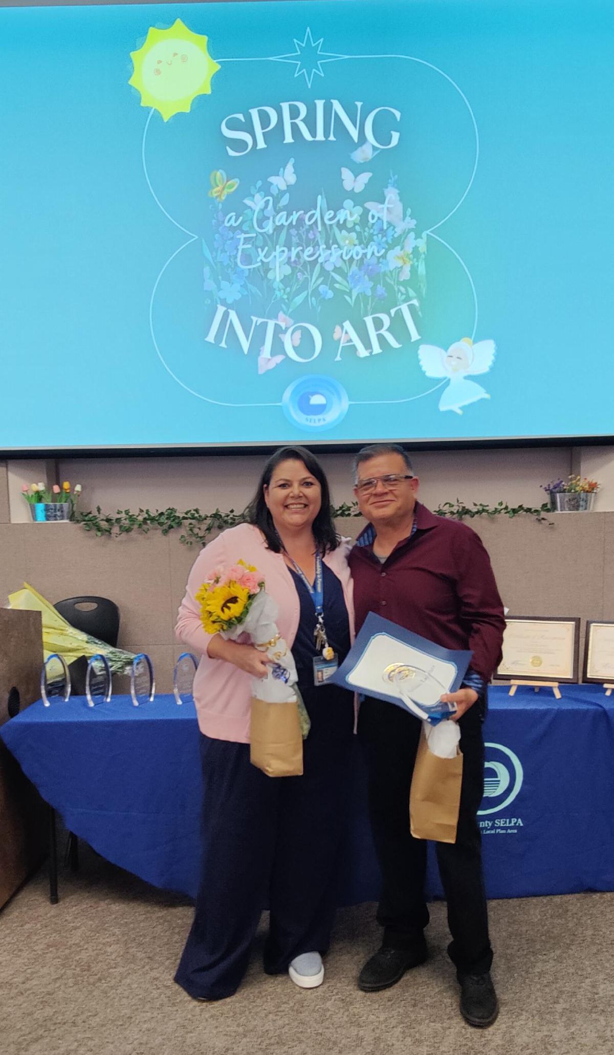 Staff member Efrain Bobadilla being recognized at last year's art show