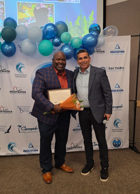 Marcus Jackson and Russell Coronado posing together for a photo at our recent art show