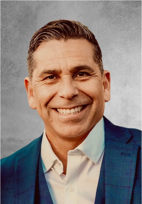 Headshot of our Executive Director Russell Coronado