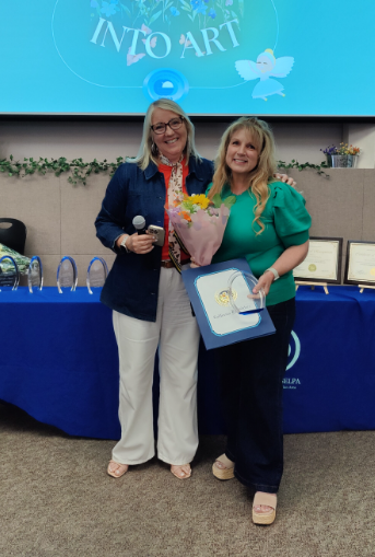 Staff member CareyAnn Sutherland being recognized at District Awards Recognition