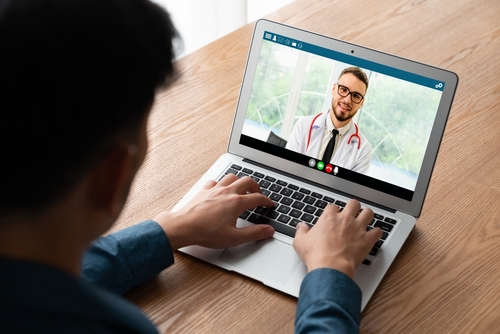 Doctor video call online by modish telemedicine software application for virtual meeting with patient