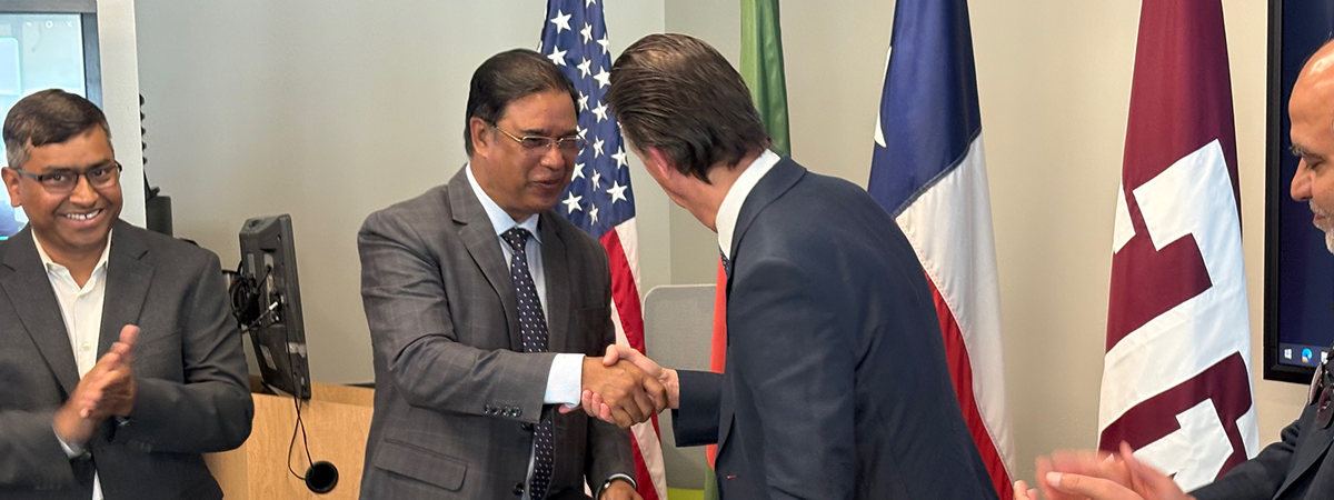 Jalal Ahmed and Stratos Pistikopoulos shake hands after signing an MOU between the  Bangladesh Energy Regulatory Commission and Texas A&M University