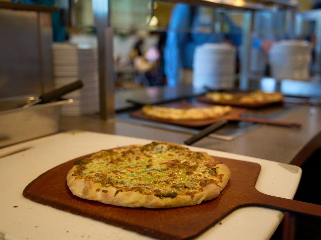Pizza on a wooden pizza tray