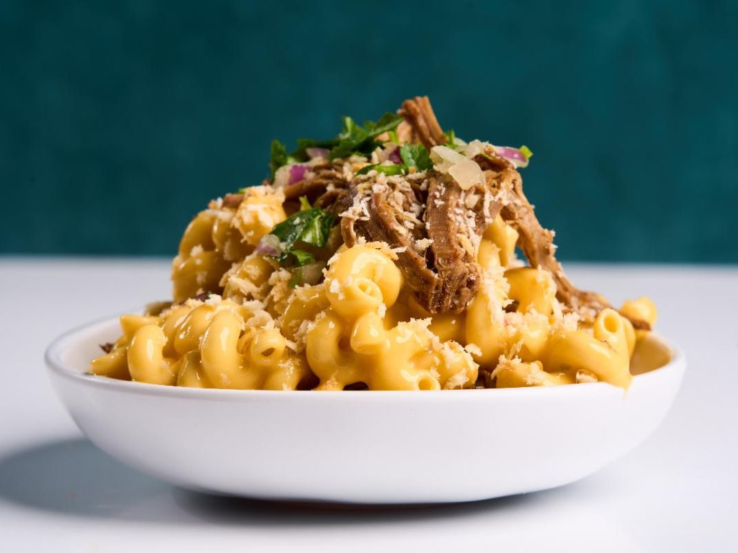 Student handing meal card to cashier to swipe in to Segundo DC