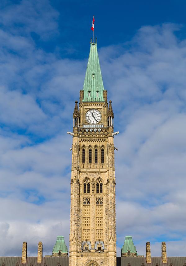 Closeup to the Ottawa Parliament Clock Tower in Canada during the day