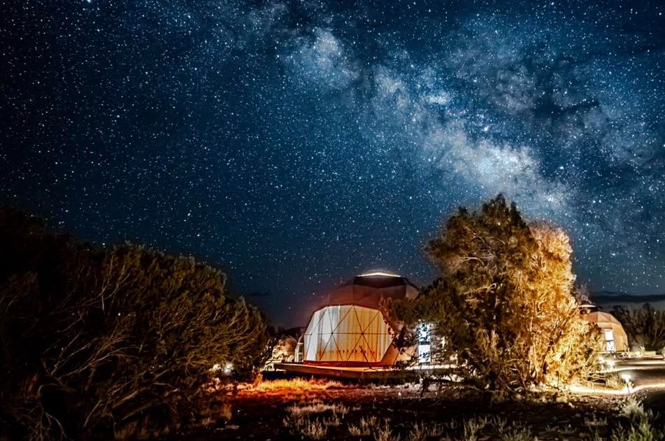 Outside view of the sky dome at night with a view of the milk way in the sky.