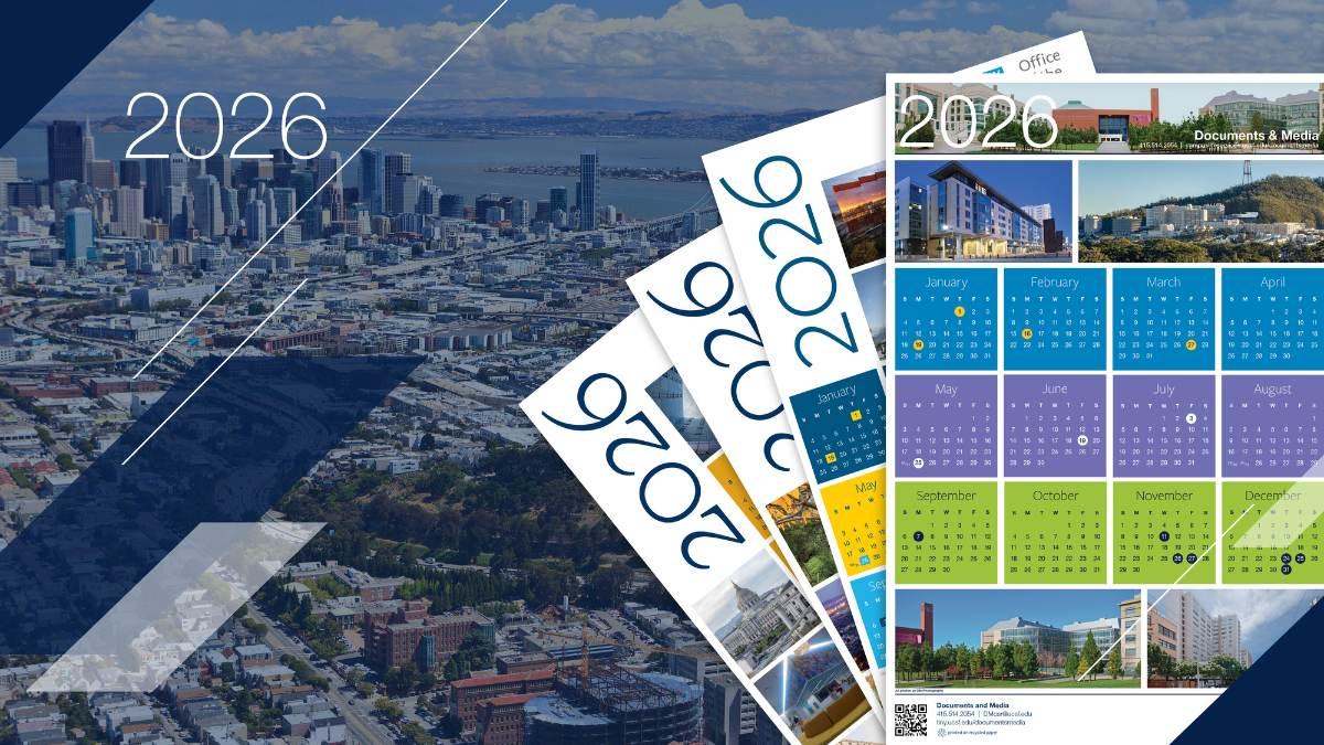 Stack of 2026 calendars over a cityscape