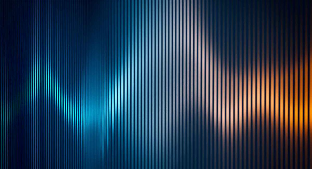 Abstract heartbeat waveform glowing in blue and orange against a dark background with vertical lines.