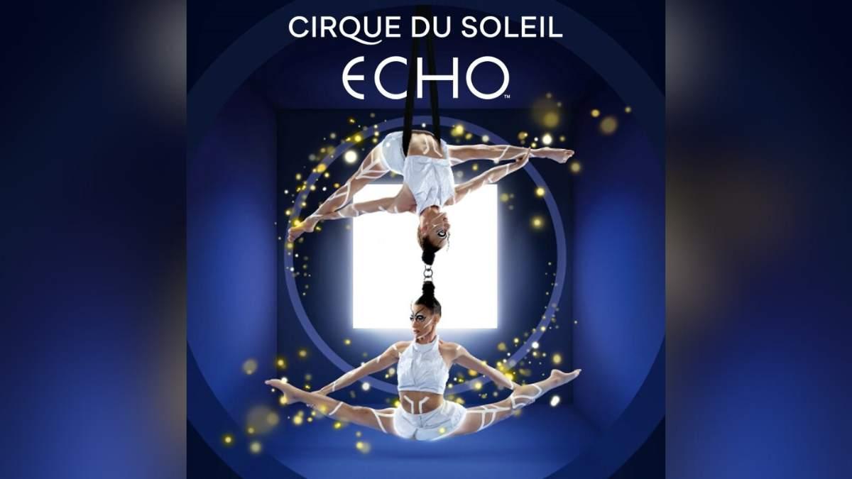 Acrobats suspended in the air performing a symmetrical pose