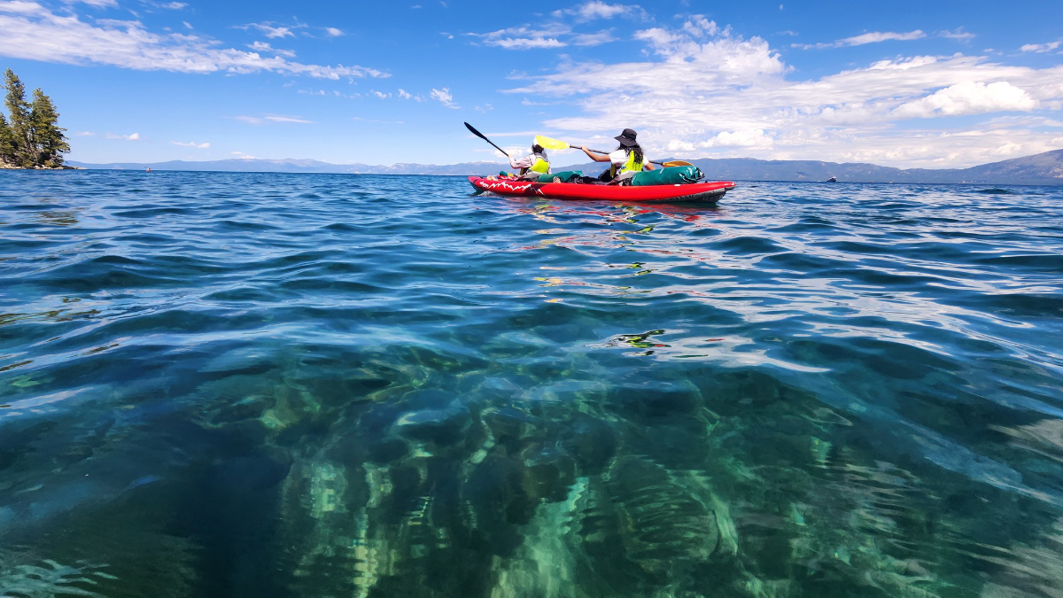 People in a canoe on blue water