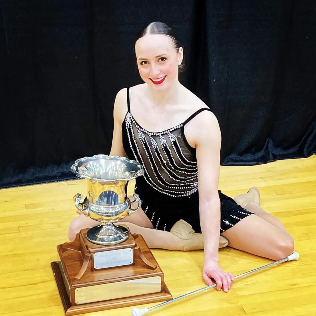 Baton twirler Julee Stewart poses with her trophy