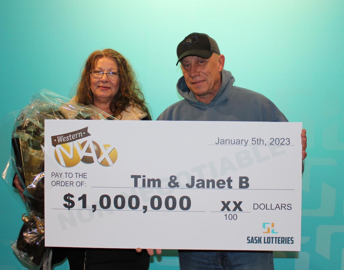 Western Max $1 million lottery winners Tim and Janet hold their cheque