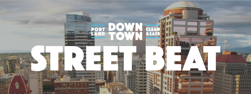 Downtown Portland cityscape with Downtown Portland Clean & Safe Logo centered and Street Beat in large letters underneath