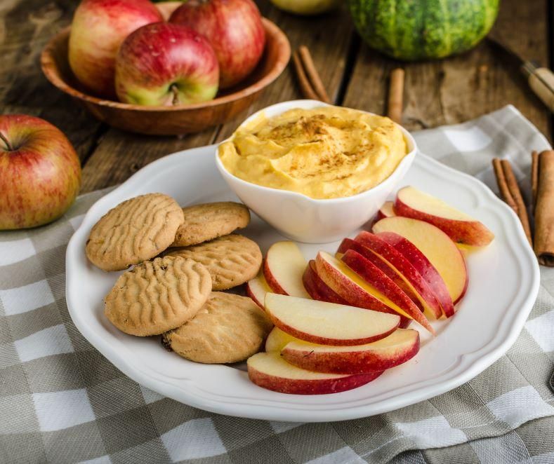 Pumpkin dip with apples and cookies.