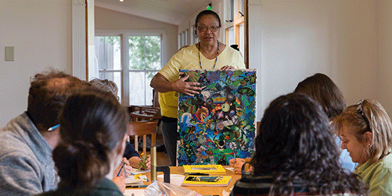 A rotating slideshow depicting children and adults making and sharing art