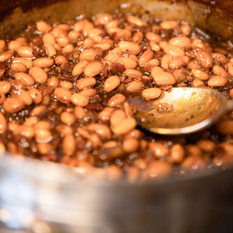 Maple baked beans cooking in a pot