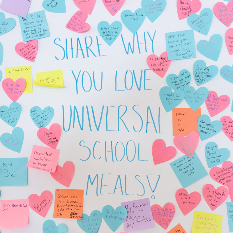 Colorful sticky notes with handwritten messages surround the text, "Share why you love universal school meals!" on a white background.