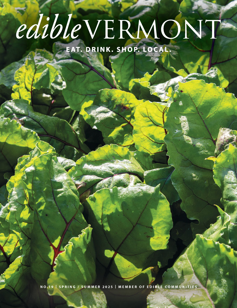The cover of Edible Vermont magazine, featuring a closeup image of beet leaves in a garden.